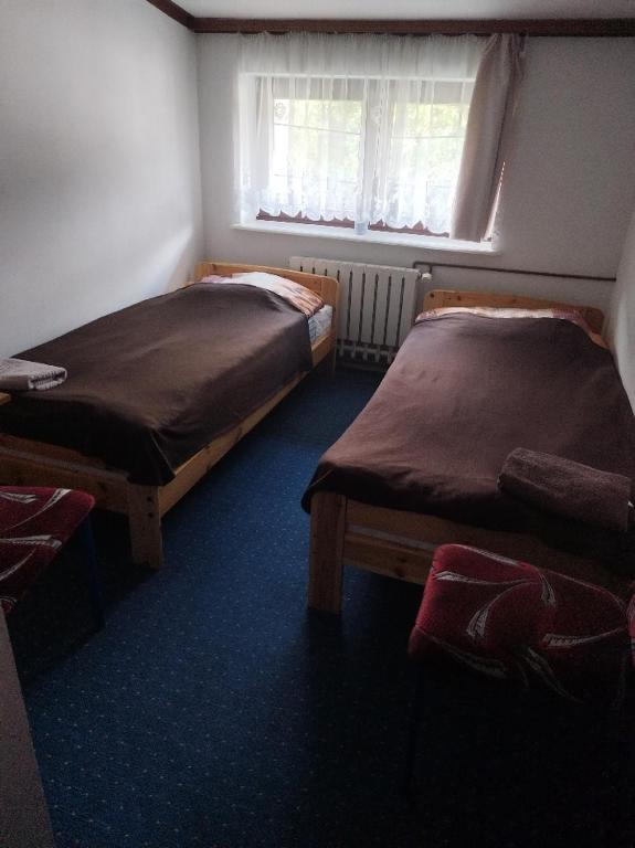 Postel nebo postele na pokoji v ubytování Gościniec Silver
