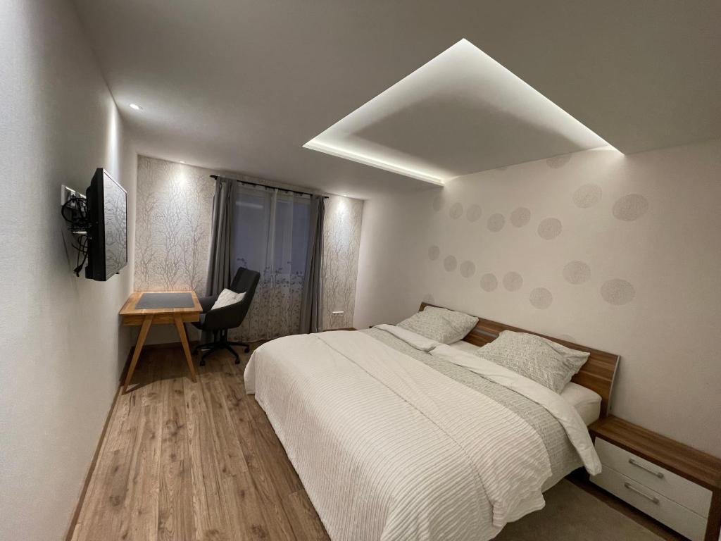 מיטה או מיטות בחדר ב-Ferienwohnung Zur Wupper