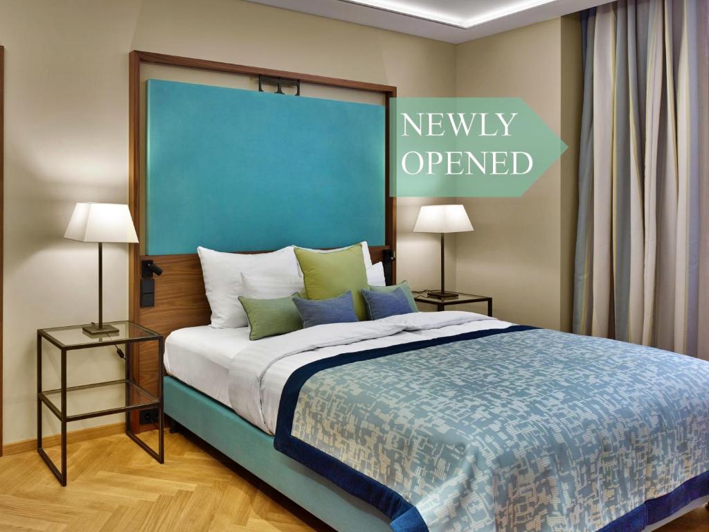 Postel nebo postele na pokoji v ubytování EST Grand Hotel Savoy