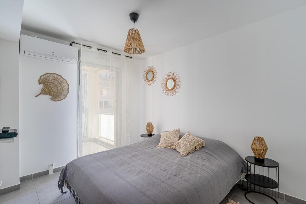 Postel nebo postele na pokoji v ubytování Panier, Major, appartement de 47 m2, parking et terrasse