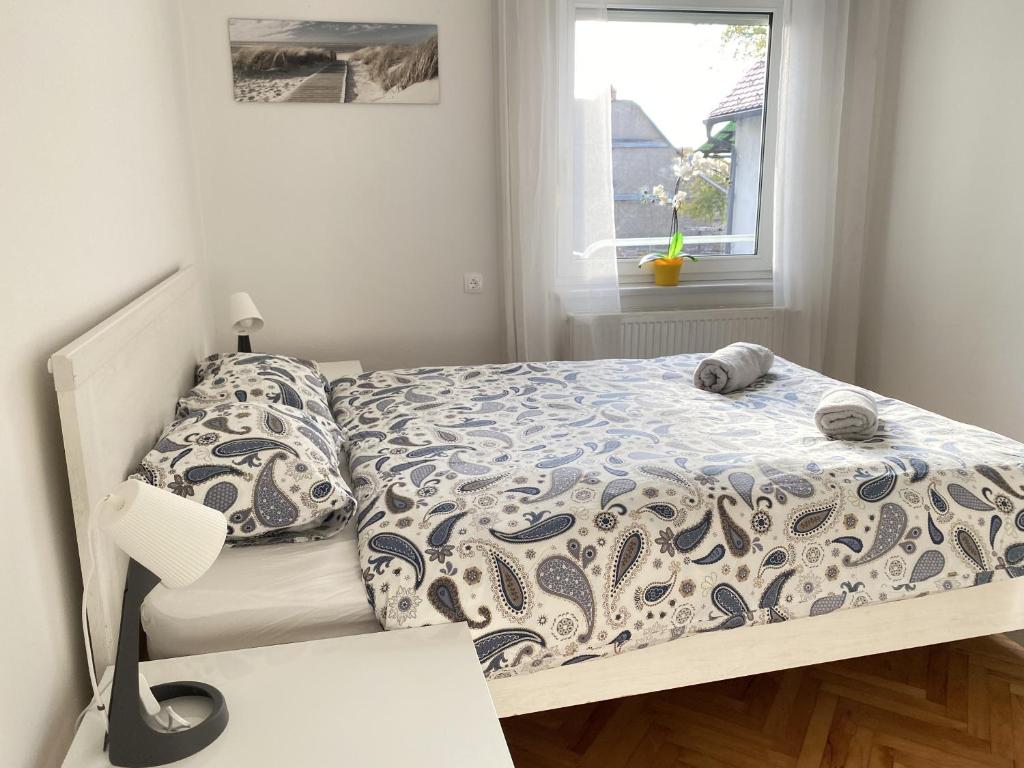 Postel nebo postele na pokoji v ubytování Villa pod Gradom