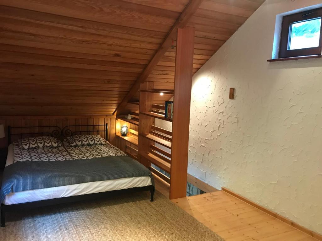 Posteľ alebo postele v izbe v ubytovaní Domek nad potokiem