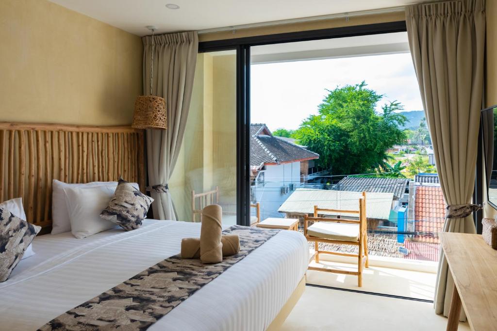 Postel nebo postele na pokoji v ubytování Riviera Beach Hotel