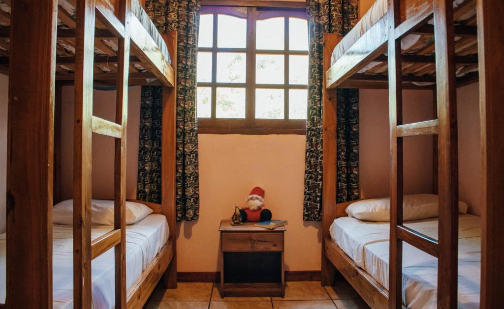 Postel nebo postele na pokoji v ubytování Estrella del Monte