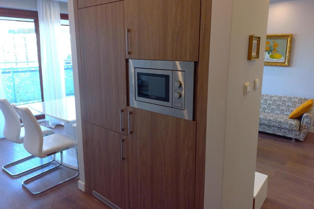 Televízia a/alebo spoločenská miestnosť v ubytovaní erApartments Oxygen Residence