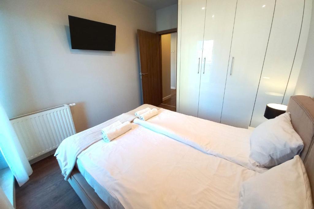 Posteľ alebo postele v izbe v ubytovaní erApartments Oxygen Residence
