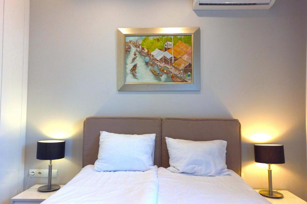 Posteľ alebo postele v izbe v ubytovaní erApartments Oxygen Residence