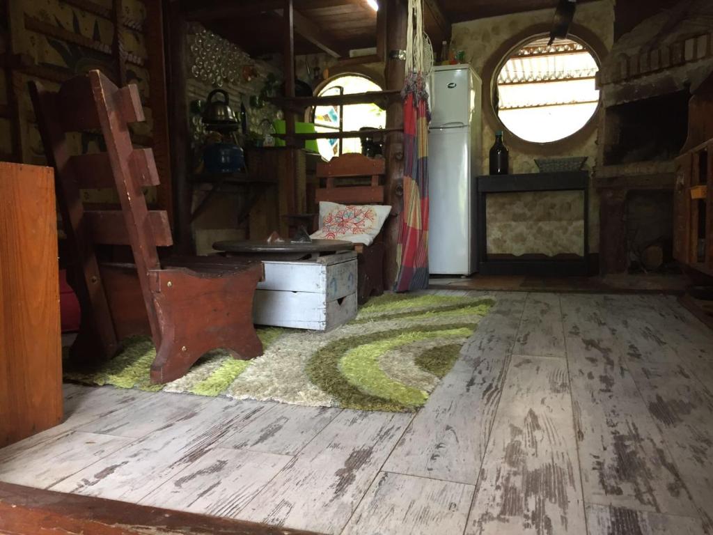an inside view of an old rv with a green rug on the floor at Casa Hobbit in Salinas 