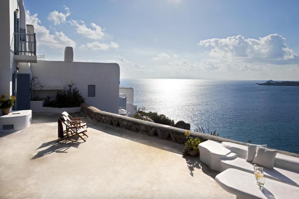 a view of the ocean from the balcony of a house at Elegance Villa in Platis Gialos