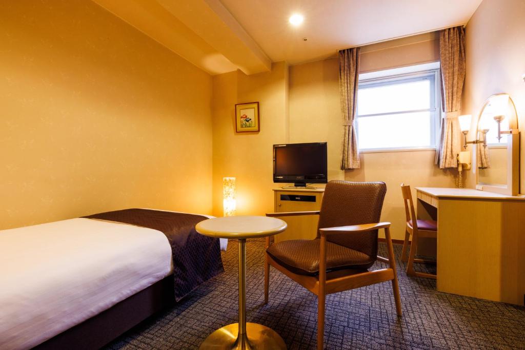 TV a/nebo společenská místnost v ubytování KAMENOI HOTEL Itako