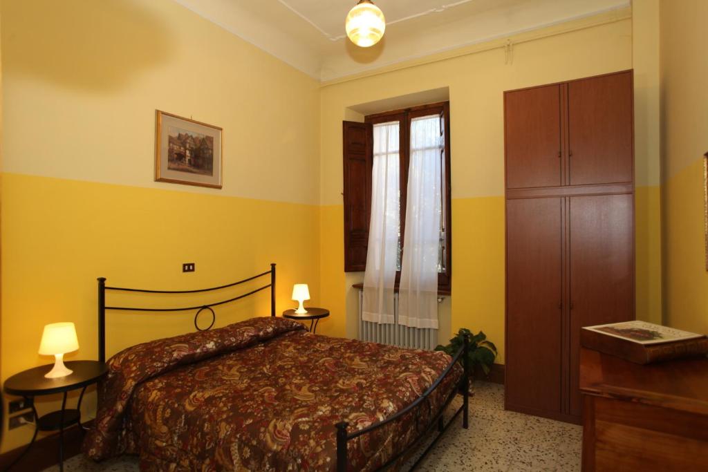 A bed or beds in a room at B&B Santa Chiara