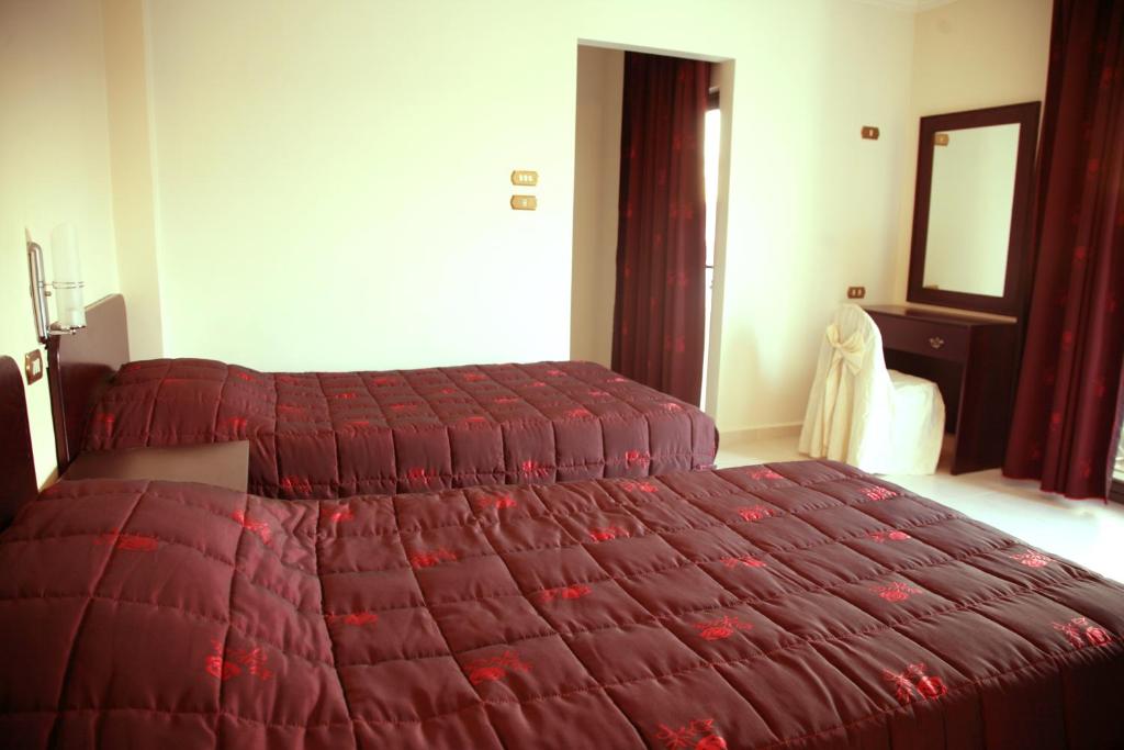 Postel nebo postele na pokoji v ubytování Salome Hotel