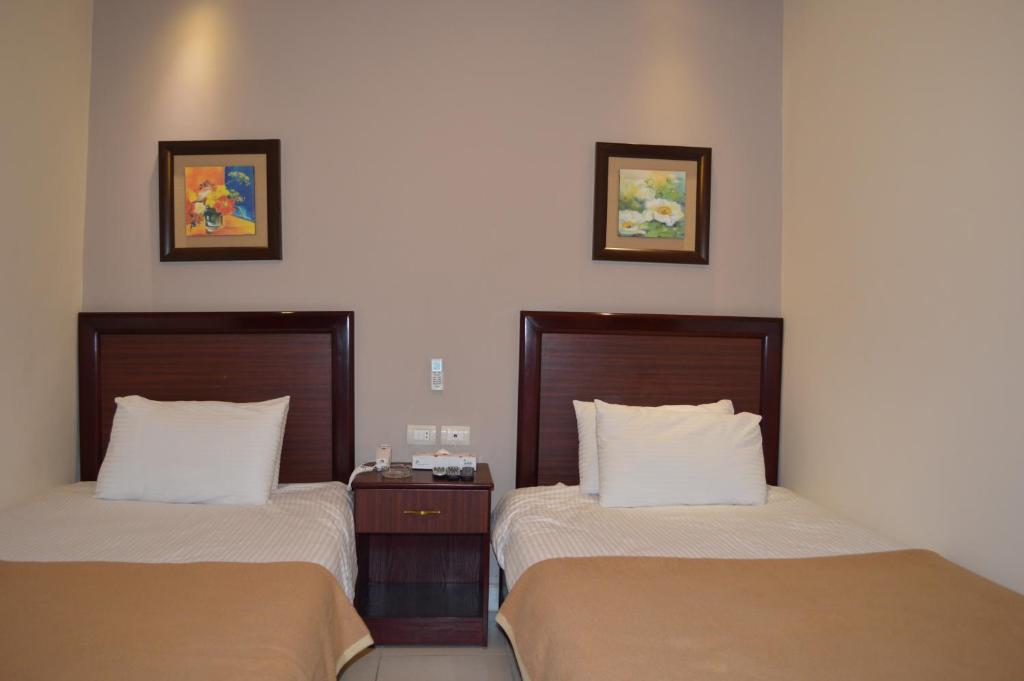 Postel nebo postele na pokoji v ubytování Salome Hotel