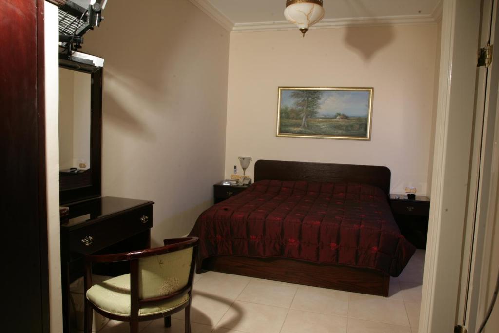 Postel nebo postele na pokoji v ubytování Salome Hotel