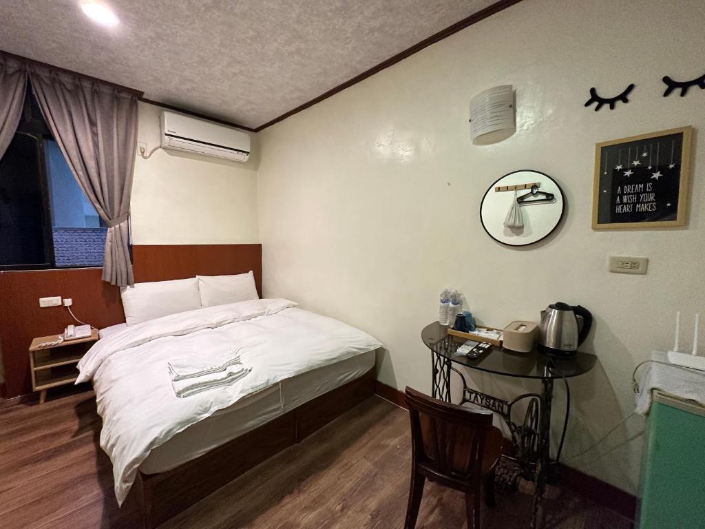 Postel nebo postele na pokoji v ubytování Ming Ren Hotspring Hotel