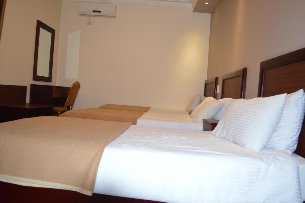 Postel nebo postele na pokoji v ubytování Salome Hotel