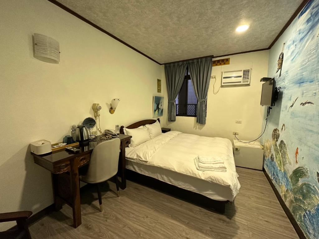 Postel nebo postele na pokoji v ubytování Ming Ren Hotspring Hotel