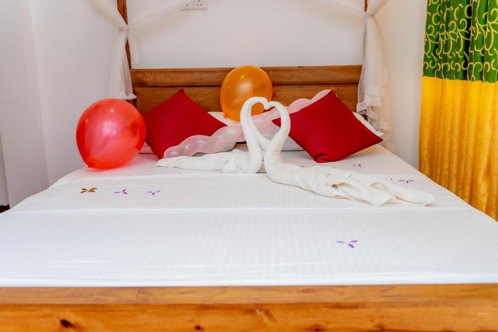 Postel nebo postele na pokoji v ubytování Rainforest Holiday Inn