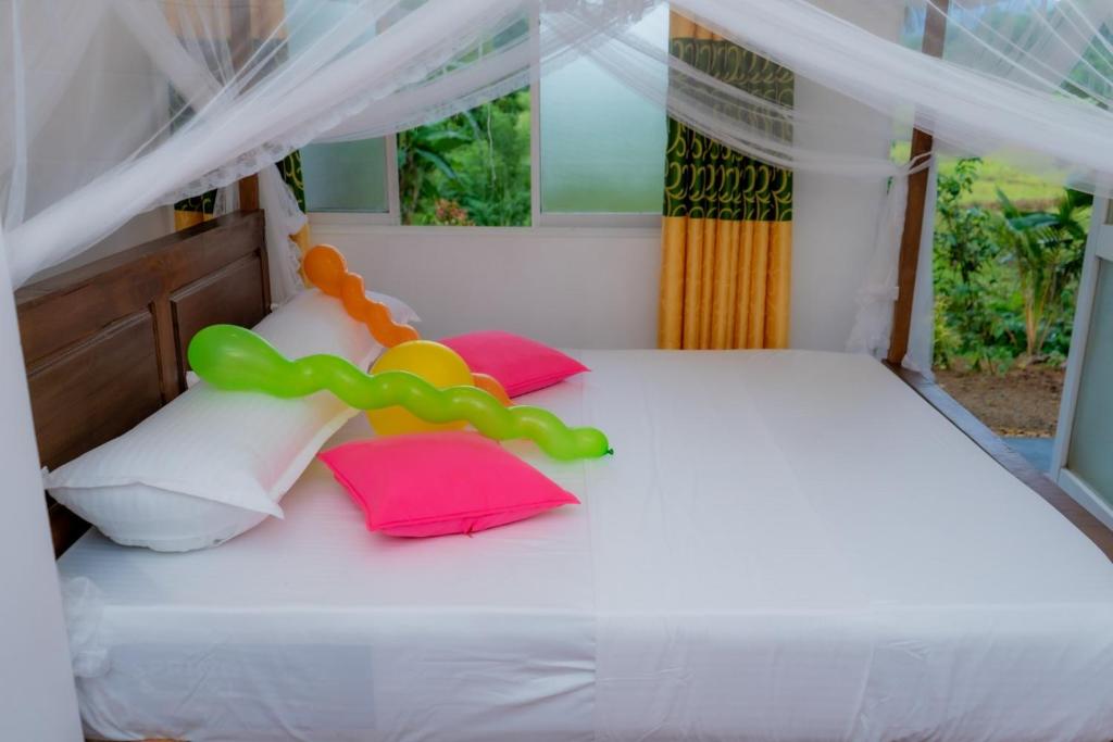 Postel nebo postele na pokoji v ubytování Rainforest Holiday Inn