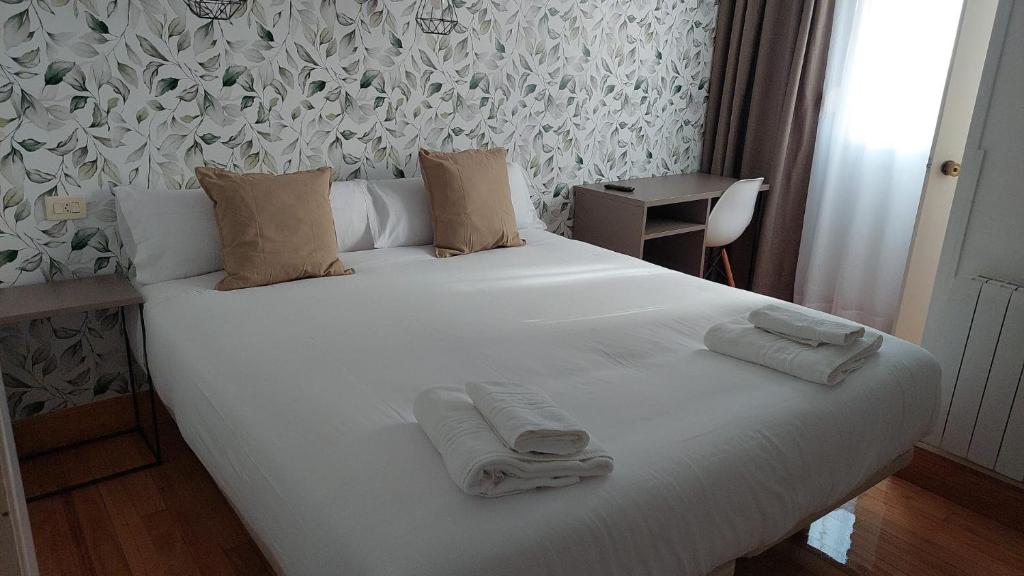 Postel nebo postele na pokoji v ubytování Hotel Norte