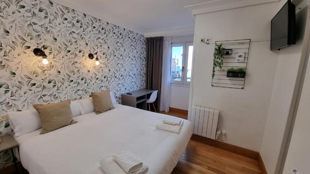 Postel nebo postele na pokoji v ubytování Hotel Norte