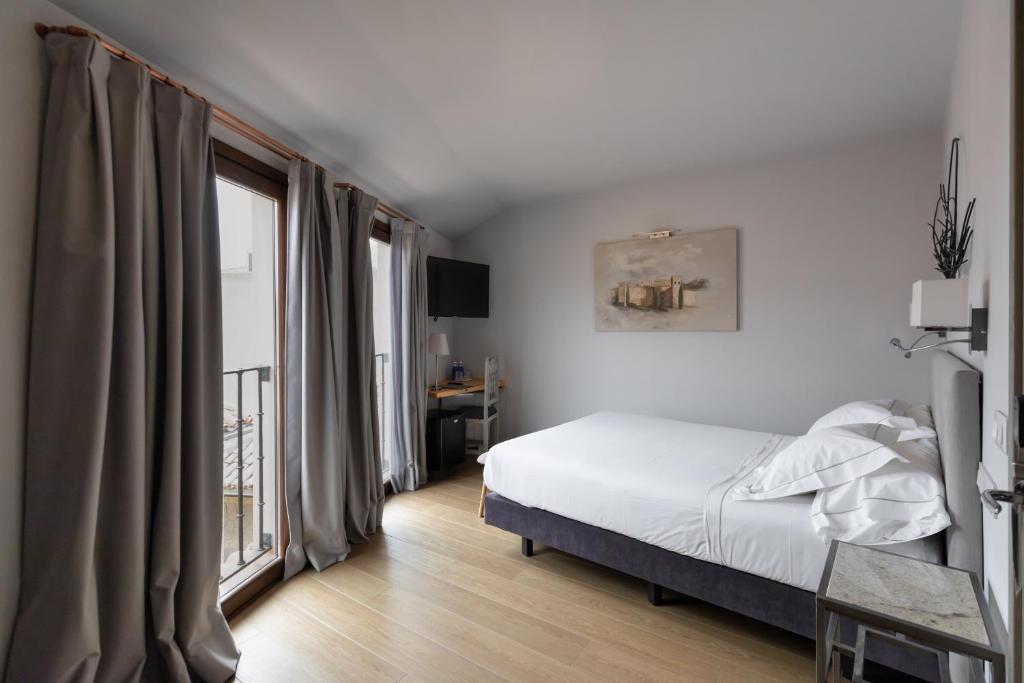 Postel nebo postele na pokoji v ubytování Hotel Boutique Posada de Sillería