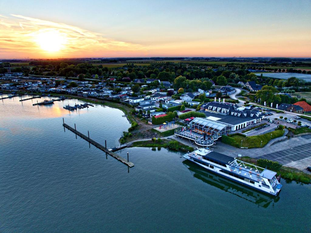 an aerial view of a marina at sunset at Moeke Mooren in Appeltern