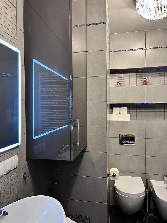 Kúpeľňa v ubytovaní Trevilles Apartamenty Londyn