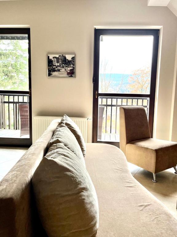 Posteľ alebo postele v izbe v ubytovaní Trevilles Apartamenty Londyn