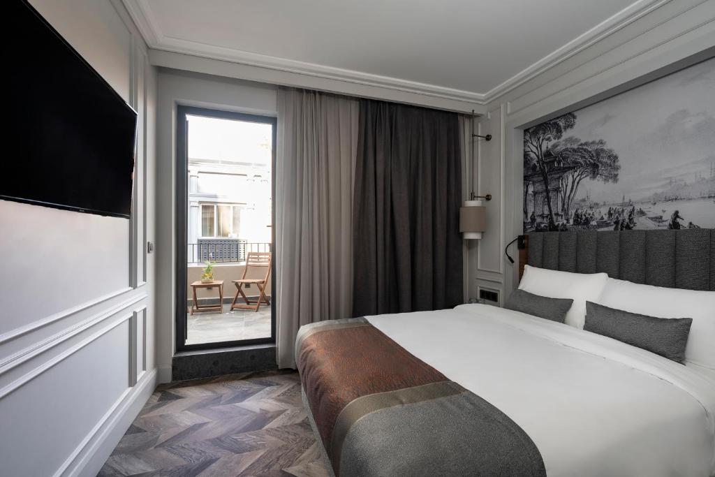 Postel nebo postele na pokoji v ubytování Livro Hotel