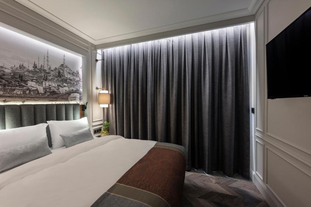 Postel nebo postele na pokoji v ubytování Livro Hotel