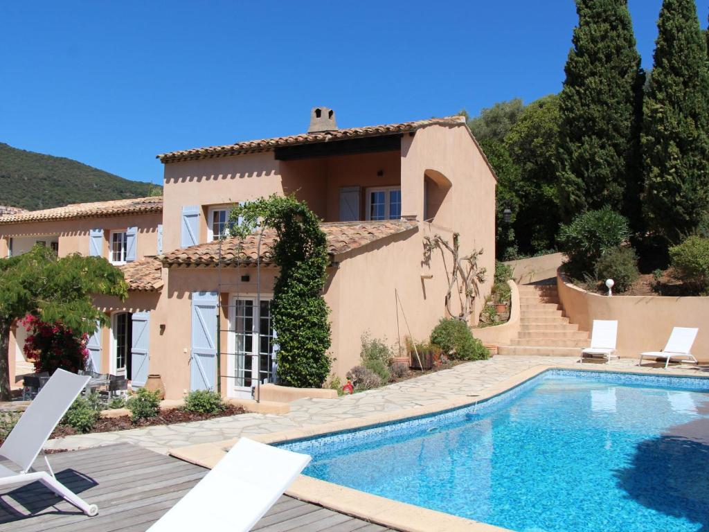 a villa with a swimming pool in front of a house at Villa Mare E Sole by Interhome in Cavalaire-sur-Mer