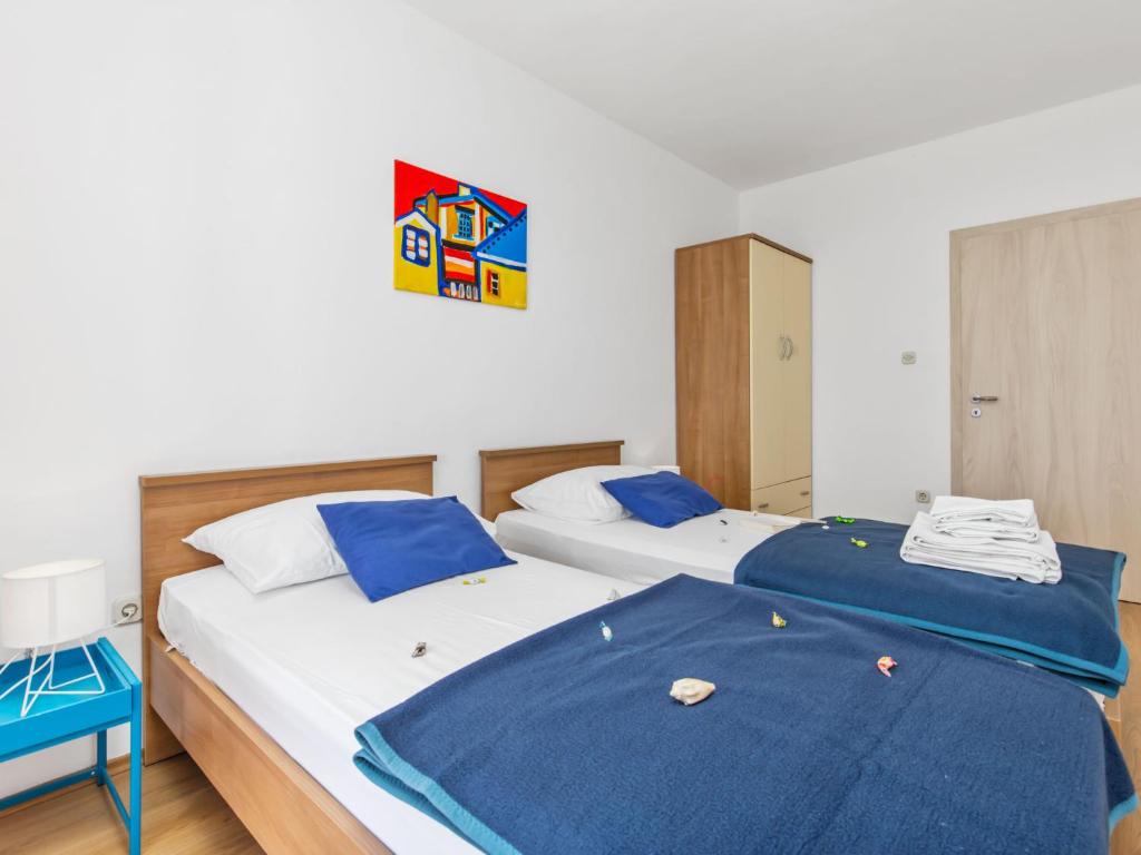 Postel nebo postele na pokoji v ubytování Apartment Marina-8 by Interhome