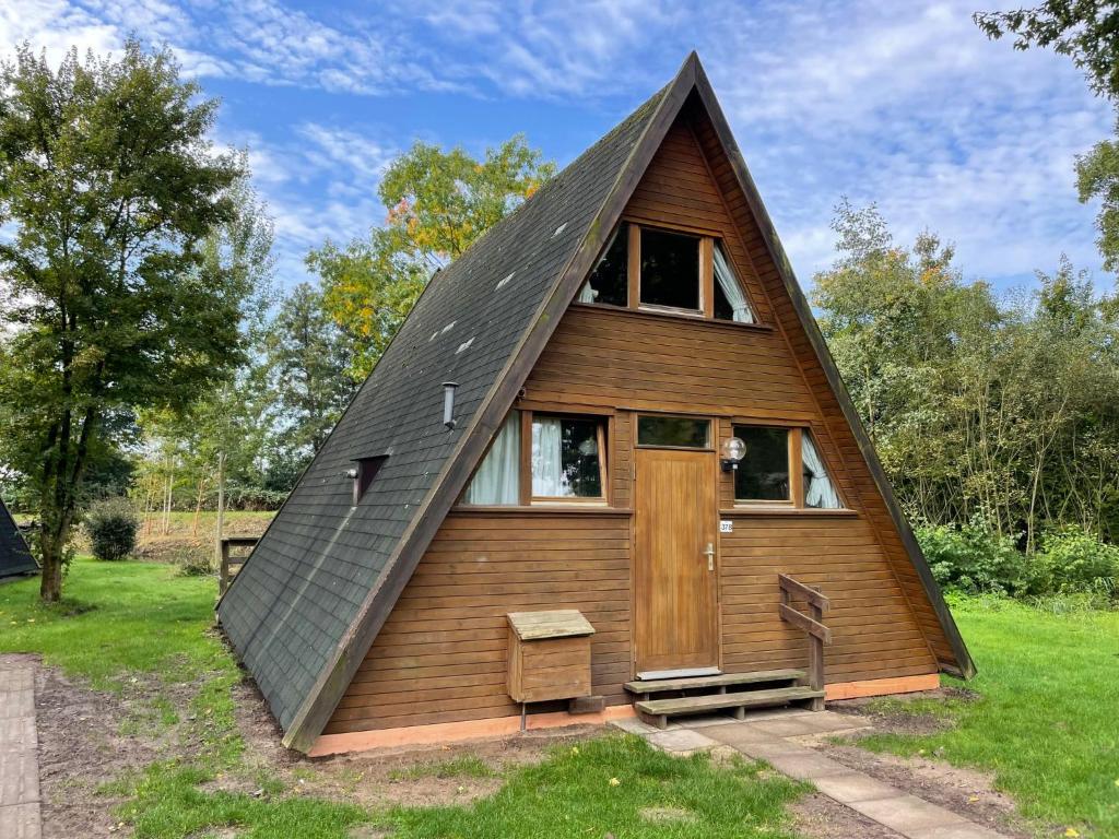 a small house with a pitched roof at Holiday Home Geesthof-5 by Interhome in Klint