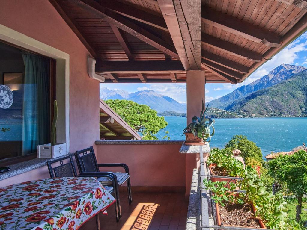 a balcony with a view of a lake and mountains at Apartment Terrazzo fiorito by Interhome in Musso
