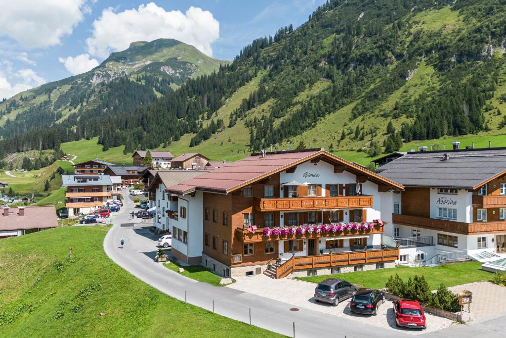 an aerial view of a village with a mountain at Hotel Bianca in Lech am Arlberg