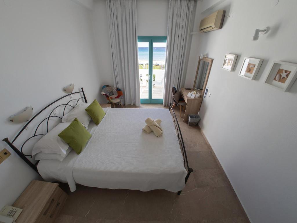 Postel nebo postele na pokoji v ubytování Amaryllis Beach Hotel