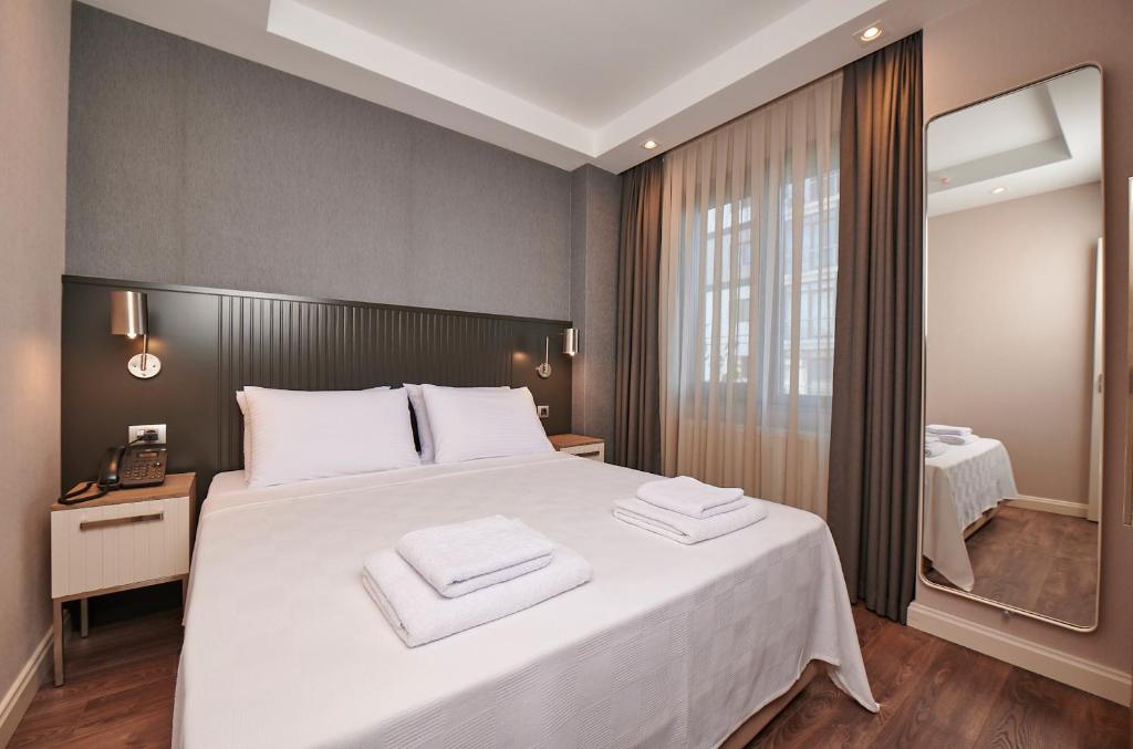 Postel nebo postele na pokoji v ubytování Livinton İstanbul Ataşehir
