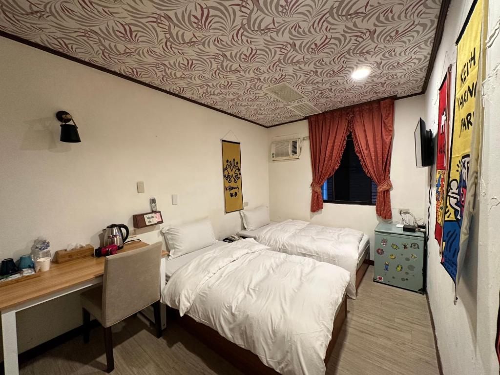 Postel nebo postele na pokoji v ubytování Ming Ren Hotspring Hotel