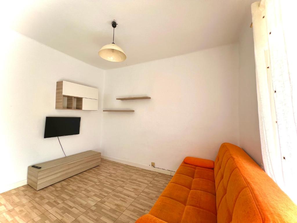 TV a/nebo společenská místnost v ubytování Apartamento para grupos de 7 en Carlos Büigas