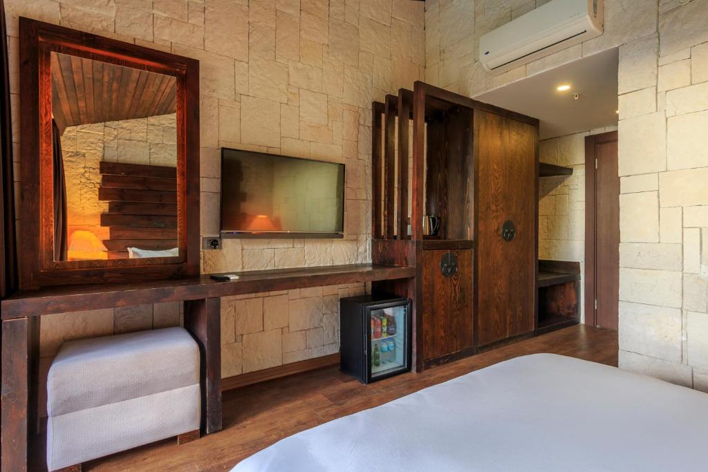 Postel nebo postele na pokoji v ubytování Manaspark Deluxe Hotel