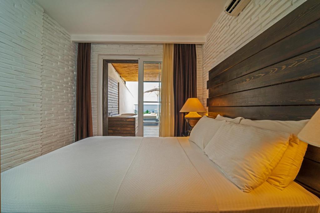 Postel nebo postele na pokoji v ubytování Manaspark Deluxe Hotel