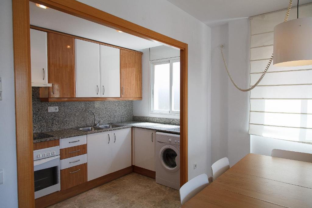 Kuchyň nebo kuchyňský kout v ubytování UHC Ventura Park Apartments