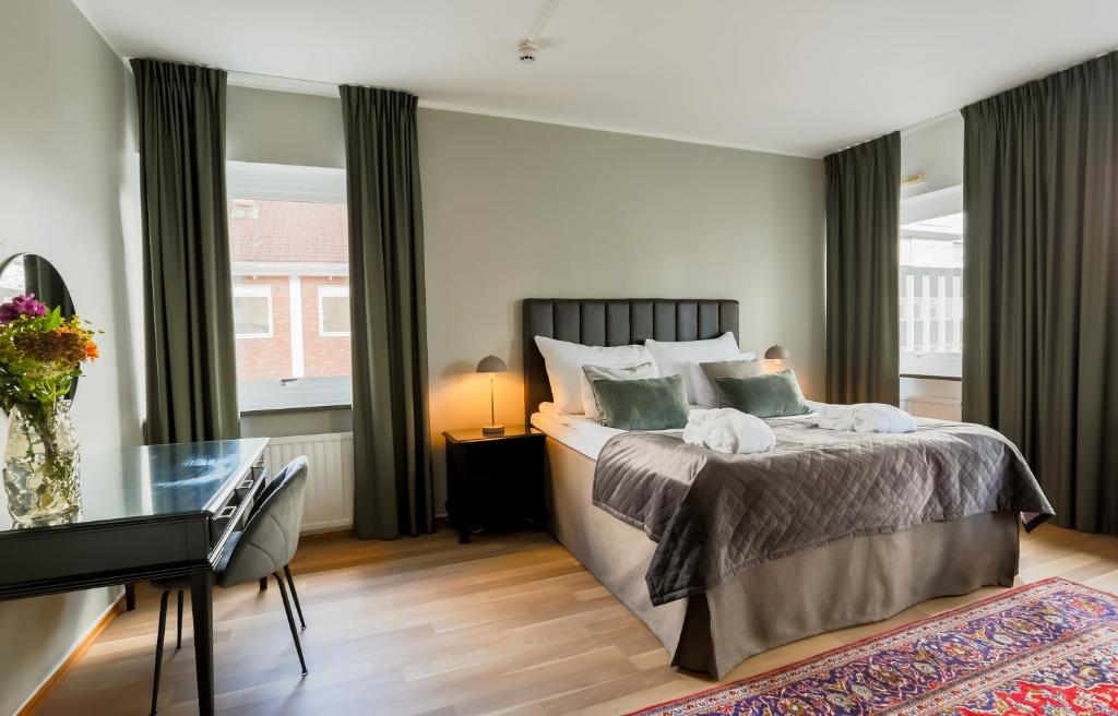 Postel nebo postele na pokoji v ubytování Home Hotel Cardinal