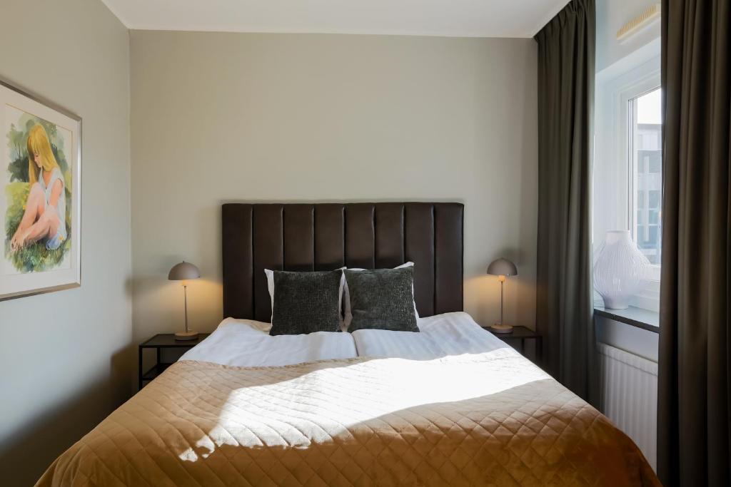 Postel nebo postele na pokoji v ubytování Home Hotel Cardinal