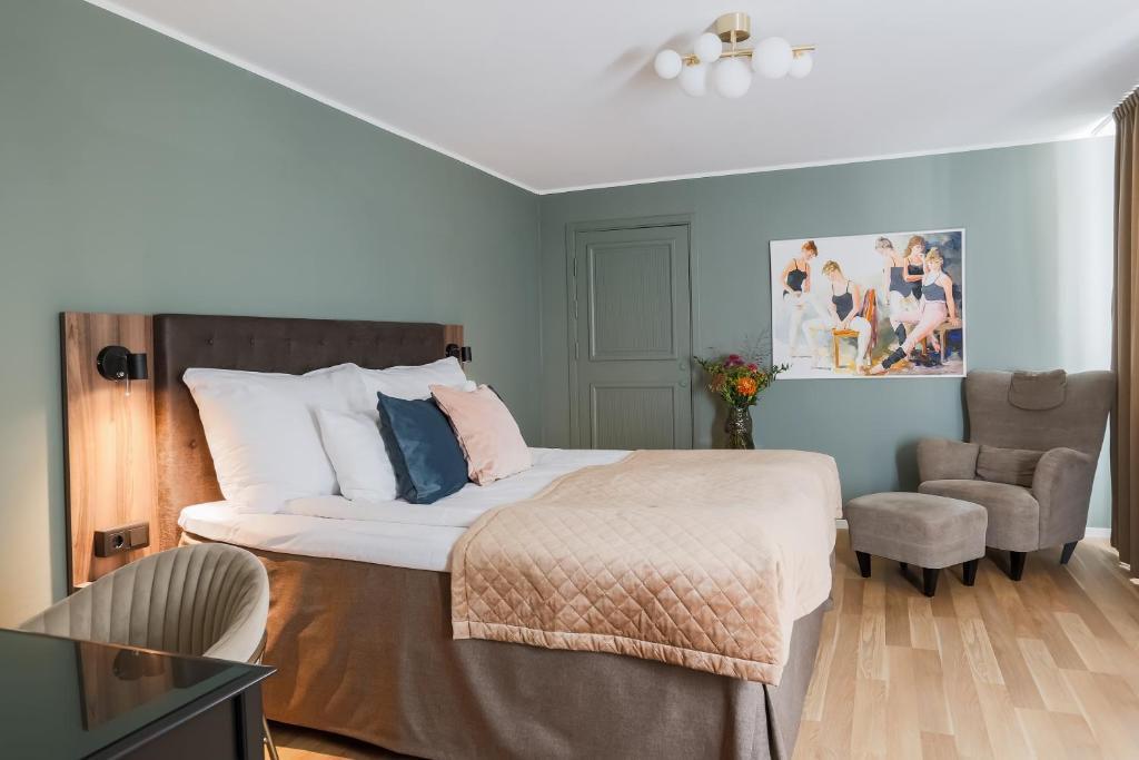 Postel nebo postele na pokoji v ubytování Home Hotel Cardinal