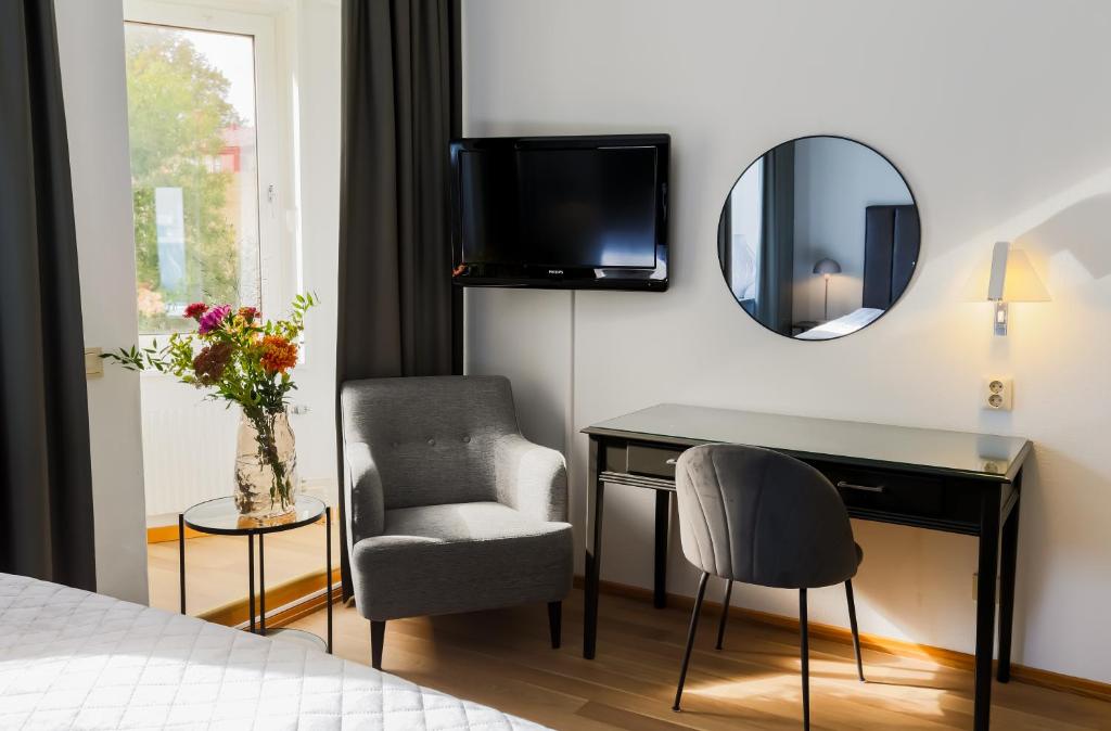 TV a/nebo společenská místnost v ubytování Home Hotel Cardinal