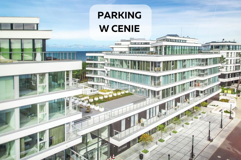 a rendering of a building with the words parkingvenue at Dune B - FAF in Mielno