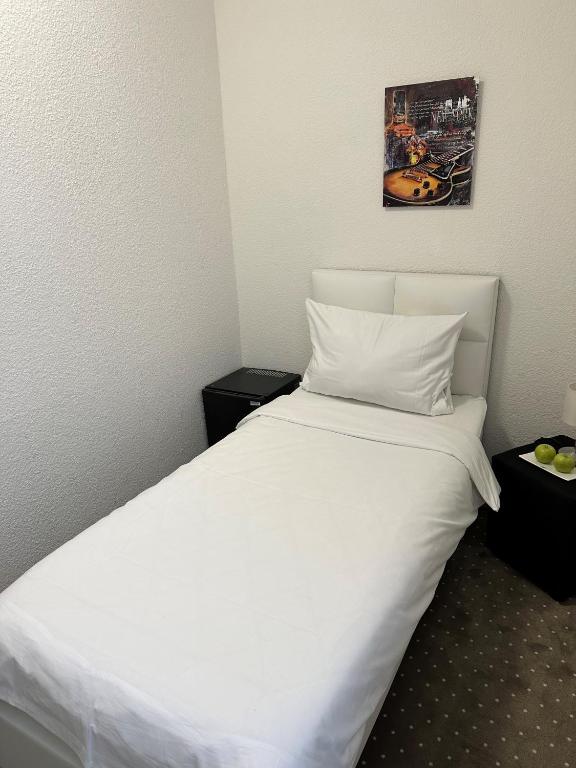 Postel nebo postele na pokoji v ubytování Hotel Goldenes Lamm