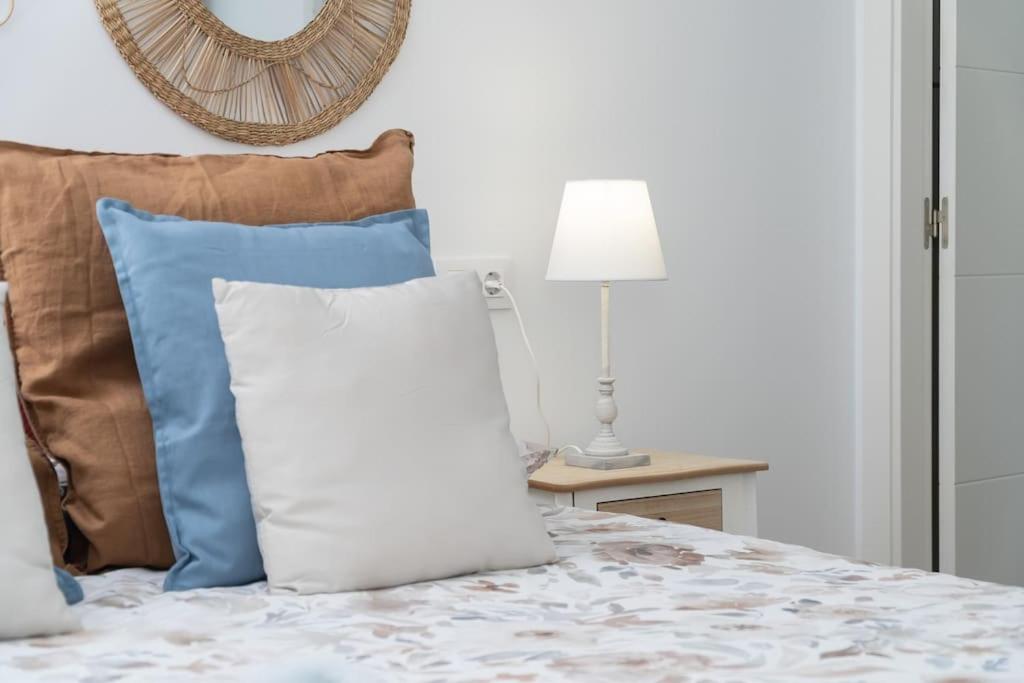 A bed or beds in a room at El Ático de Coronada
